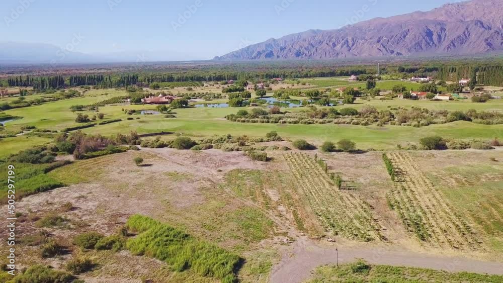 Estancias de Cafayate golf club, valley in Salta, Argentina. Panoramic drone footage. Green grass. Nature. Vineyards. part 2 Estancias de Cafayate golf club, valley in Salta, Argentina. Panoramic drone footage. Green grass. Nature. Vineyards. part 2