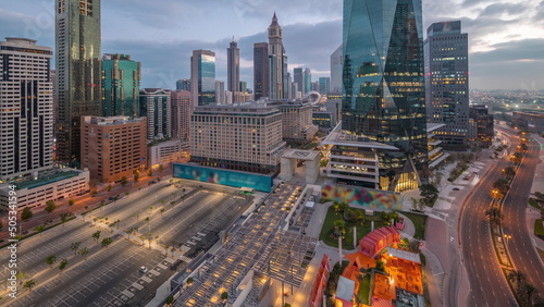 Dubai International Financial district aerial night to day timelapse. Panoramic view of business office towers.