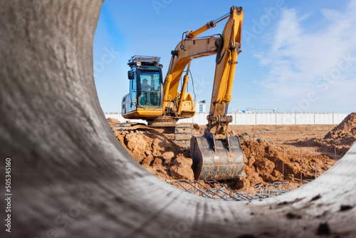 Fototapeta Heavy excavator at the construction site