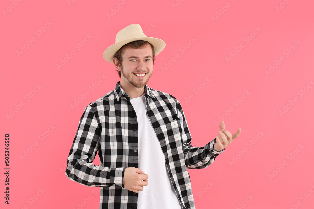 Concept of people, young man on pink background Concept of people, young man on pink background