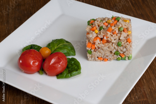 Vegetable garnish with rice and pickled tomatoes