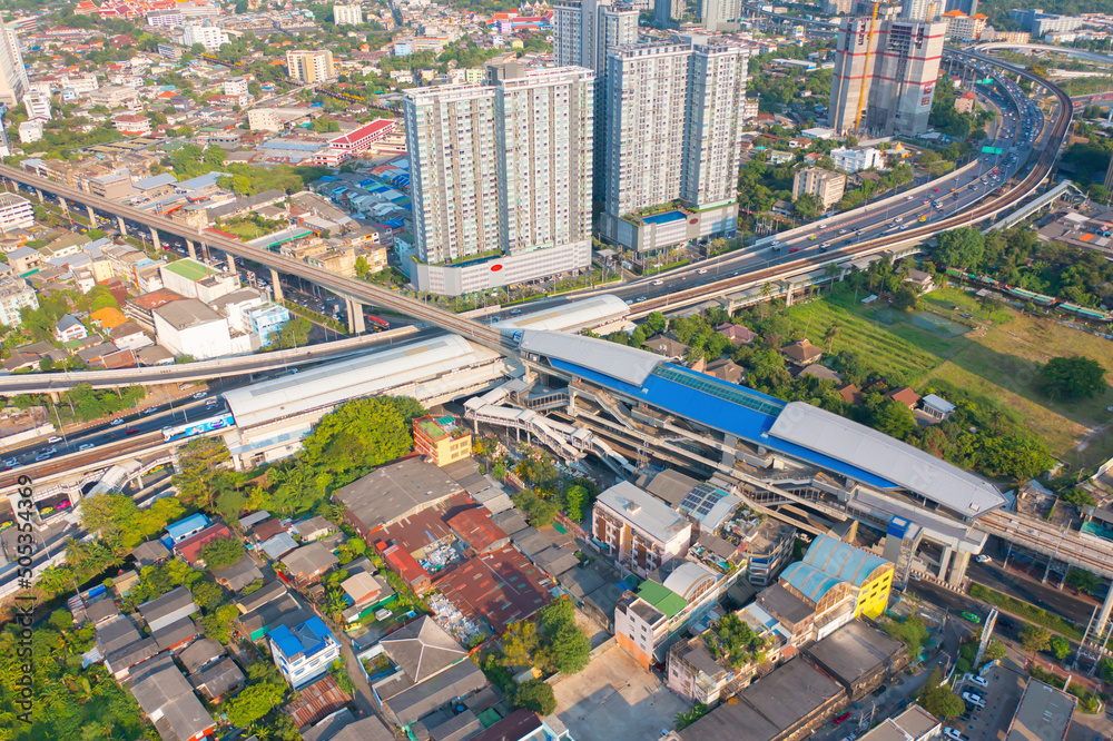Aerial view of Bangkok Railway terminal station, BTS with skyscraper buildings in urban city, Bangkok downtown skyline, Thailand. Cars on traffic street road on highways. Aerial view of Bangkok Railway terminal station, BTS with skyscraper buildings in urban city, Bangkok downtown skyline, Thailand. Cars on traffic street road on highways.