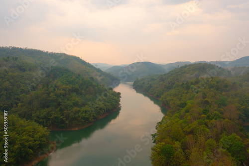 Aerial view of lakeside reservoir camping tents area with forest trees, nature environment landscape. Pang Ung, Mae Hon Son, Northern, Thailand. National park.