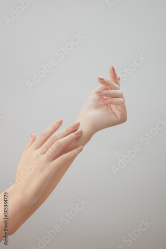 A front view of hand posing in white background for cosmetic advertising  © Tuan  Nguyen 