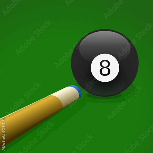shooting with a pool cue on the number 8 ball on a pool table