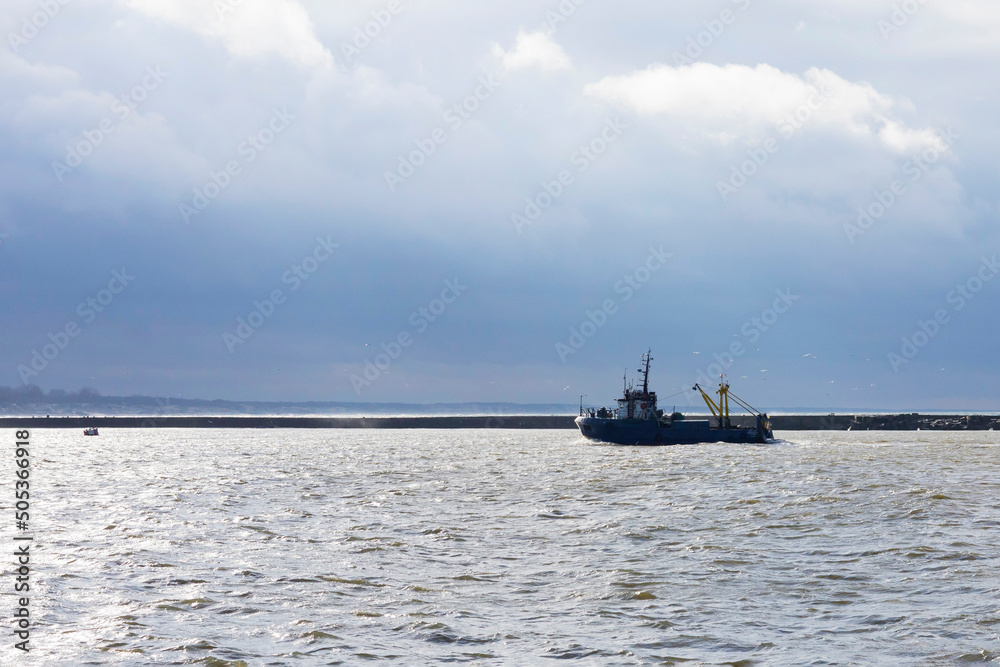 Fishing ship returns to port, fish catch, storm, bad weather