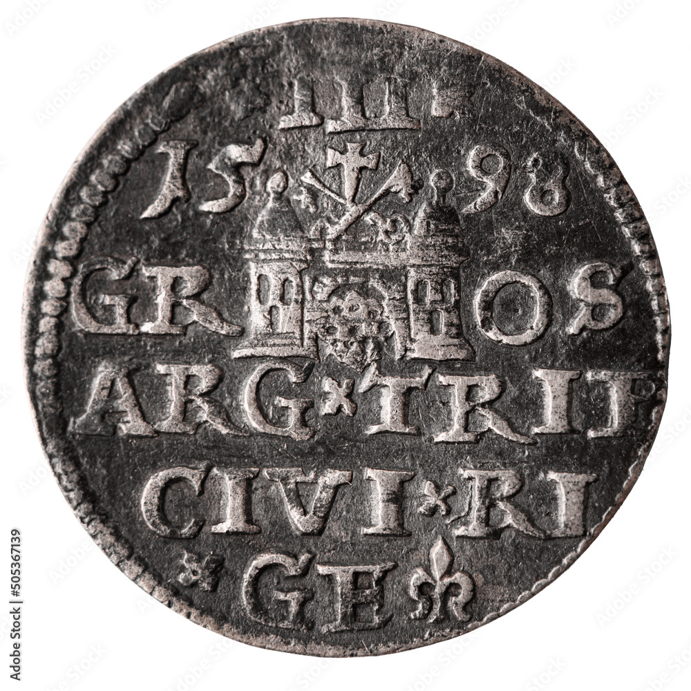 Single old silver coin 16th century isolated on white background. Reverse of three groschen with Greater coat of arms of Riga. Closeup.