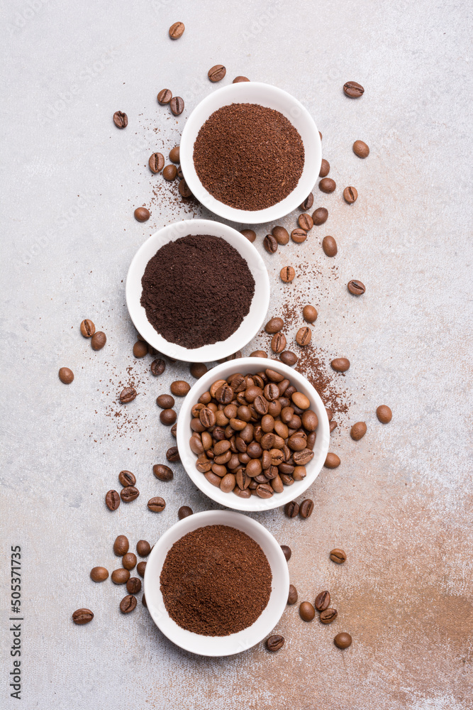 Roasted beans and different ground coffee for morning espresso Roasted beans and different ground coffee for morning espresso