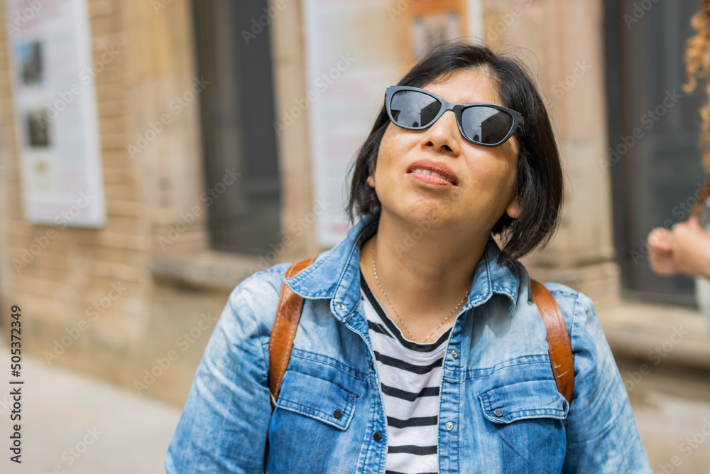 Tourist of Latin origin on vacation in the Gothic Quarter of Barcelona (Spain), travel concept. Tourist of Latin origin on vacation in the Gothic Quarter of Barcelona (Spain), travel concept.