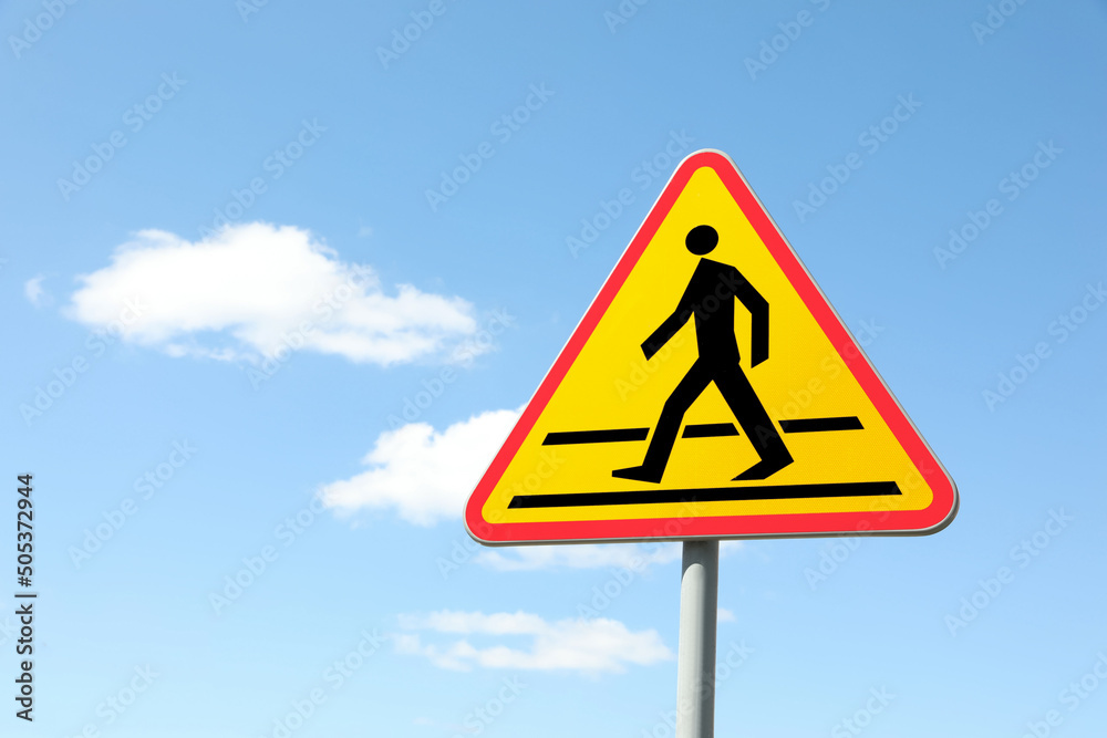 Traffic sign Pedestrian Crossing Ahead against blue sky, space for text Traffic sign Pedestrian Crossing Ahead against blue sky, space for text