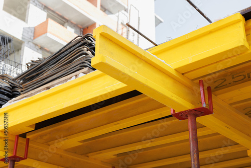 construction of an industrial plant floors with yellow i-beams. Preparing the formwork for pouring concrete. photo