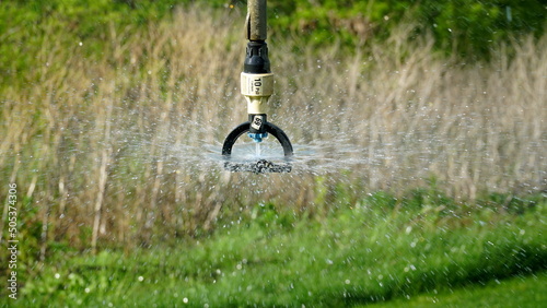 Close-up of an irrigation system for agriculture to stimulate plant growth during intense and prolonged heat. Concept: agriculture or water supply.