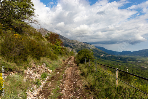 Turist's road based in Konavle region near Dubrovnik. The road along the slope of the mountain above the valley.
