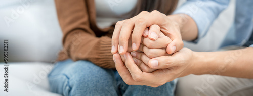 Couples hold hands to support each other while discussing family issues with a psychiatrist. Men and women have psychological empathy and understand after marriage. save divorce, Hand in hand together photo