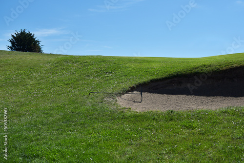 Terrain de golf et rateau photo