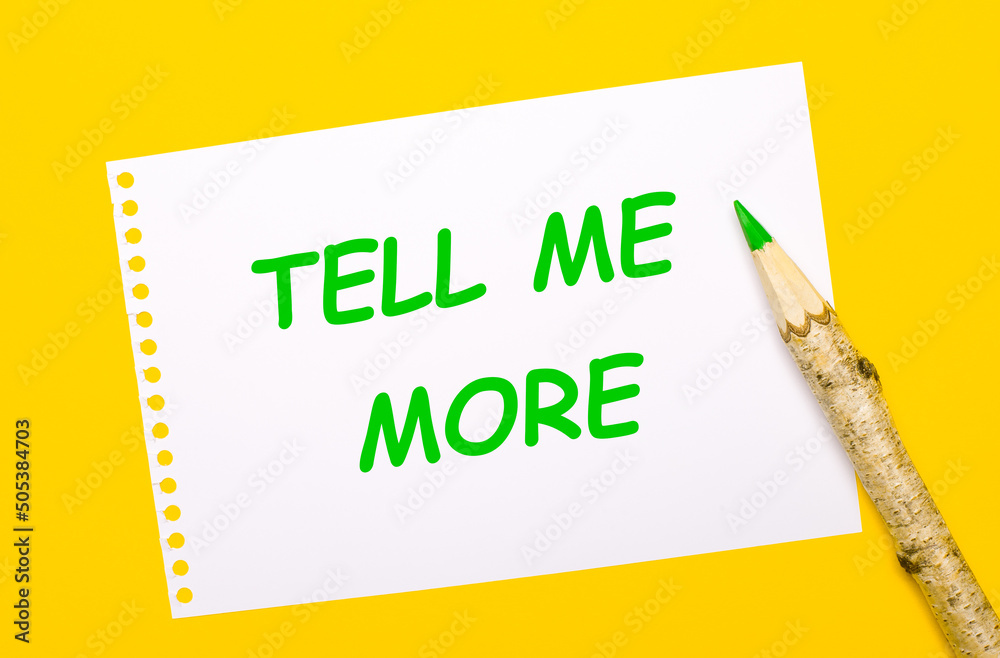 On a bright yellow background, a large wooden pencil and a white sheet of paper with the text TELL ME MORE On a bright yellow background, a large wooden pencil and a white sheet of paper with the text TELL ME MORE