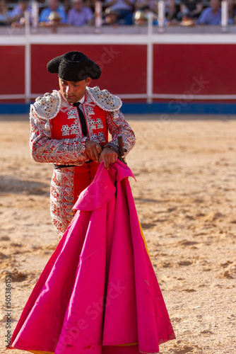 long shot of a bullfighter keeping his knife after the bullfight