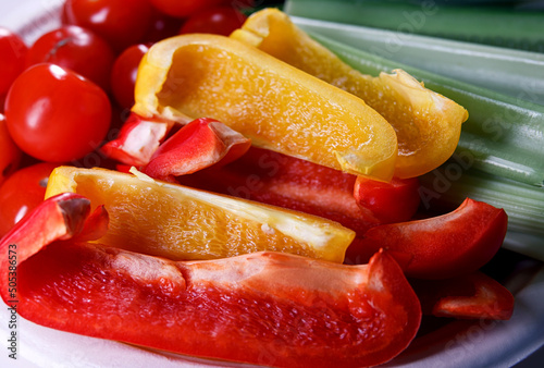 Red and yellow bell peppers cut into pieces.