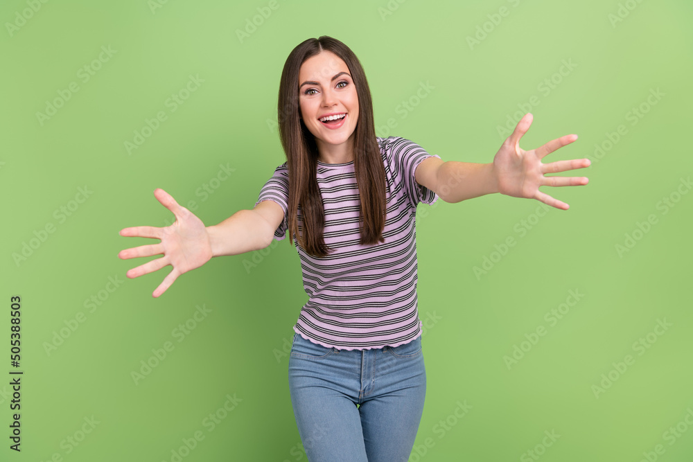 Portrait of satisfied glad person raise opened arms camera you isolated on green color background Portrait of satisfied glad person raise opened arms camera you isolated on green color background