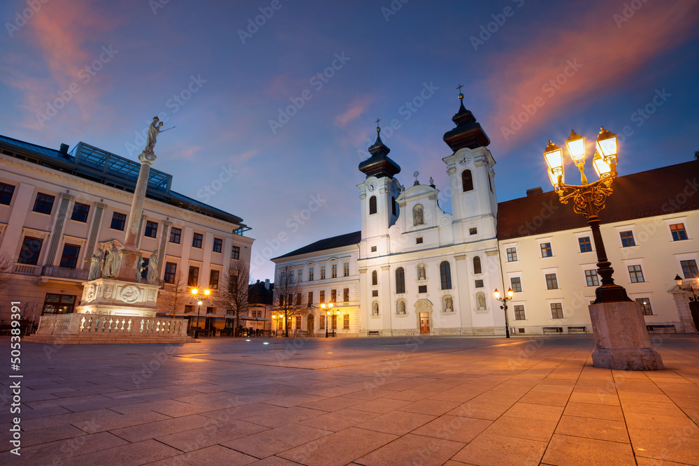 Gyor, Hungary. Cityscape image of downtown Gyor, Hungary with Szechenyi Square at sunrise.