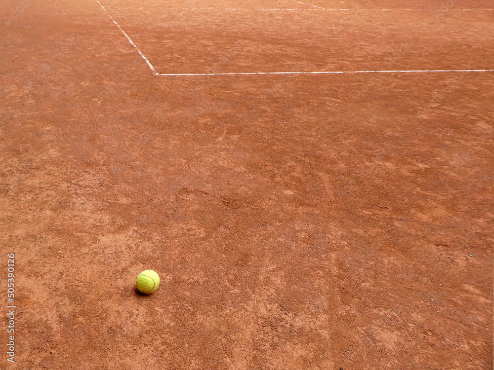 Tennis clay court with line and yellow ball