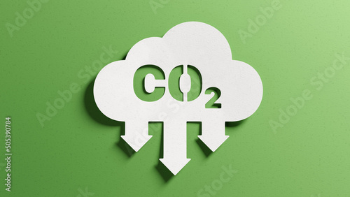 Reduce CO2 emissions to limit climate change and global warming. Low greenhouse gas levels, decarbonize, net zero carbon dioxide footprint. Abstract minimalist design, cutout paper, green background. photo