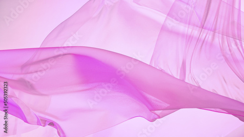 Pastel color transparent silk fabric flowing by wind