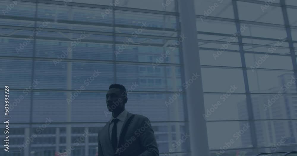 Animation of data processing over african american businessman walking Animation of data processing over african american businessman walking