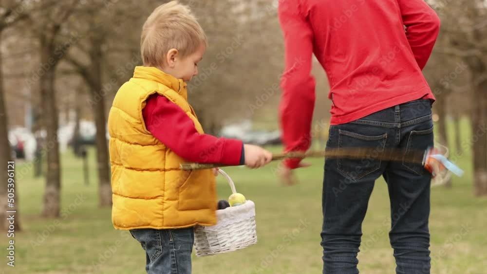 Cute preschool child, boy, holding handmade braided whip made from pussy willow, traditional symbol of Czech Easter used for whipping girls and women to receive eggs and sweets Cute preschool child, boy, holding handmade braided whip made from pussy willow, traditional symbol of Czech Easter used for whipping girls and women to receive eggs and sweets
