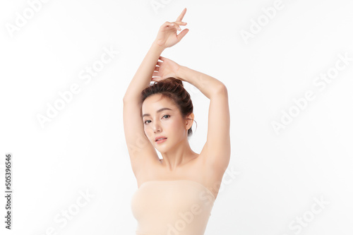 Beautiful Young Asian woman lifting hands up to show off clean and hygienic armpits or underarms on white background, Smooth armpit cleanliness and protection concept