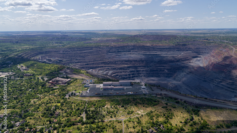 Obraz premium Open pit iron ore quarry panoramic industrial landscape aerial view