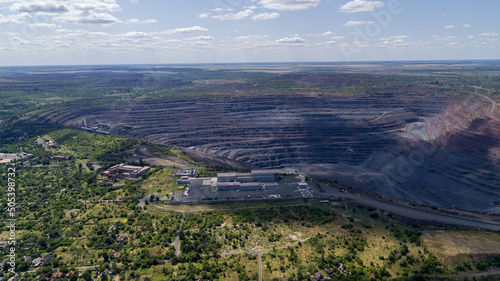 Open pit iron ore quarry panoramic industrial landscape aerial view