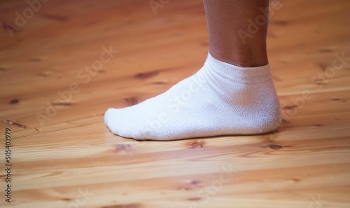 socks on human feet, person without shoes