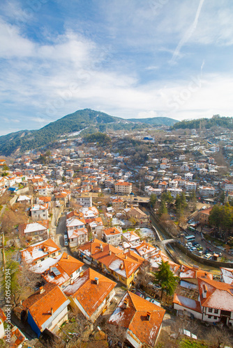 The Victory Tower (Zafer Kulesi) with the traditional houses in the background. Goynuk, Bolu, Turkey. photo