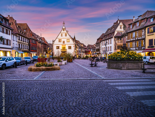 Obernai main square at dusk during spring flower season, Alsace, France