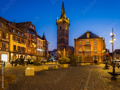 Obernai main square and Kapellturm tower at night in Alsace, France photo