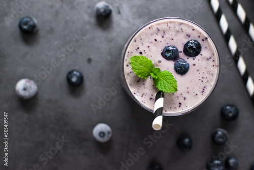 healthy blueberry detox smoothie on black rustic background