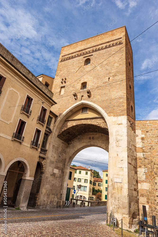 Padua downtown. Ancient medieval gate called Porta Molino or Porta dei Molini (mill gate) and fortified walls, XIII century, and Roman bridge (Ponte Molino). Veneto, Italy, Europe.