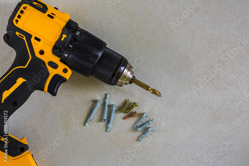 Cordless Hammer Drill and Scewdriver with screws photo