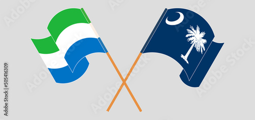 Crossed and waving flags of Sierra Leone and The State of South Carolina