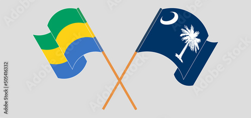 Crossed and waving flags of Gabon and The State of South Carolina