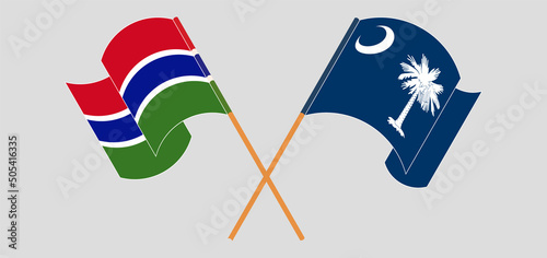 Crossed and waving flags of the Gambia and The State of South Carolina