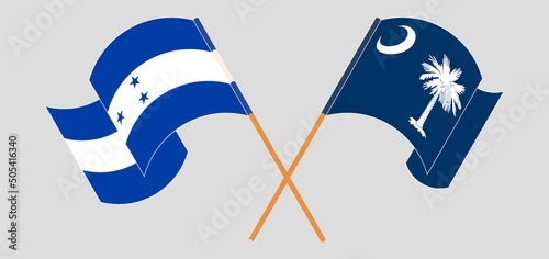 Crossed and waving flags of Honduras and The State of South Carolina