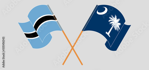 Crossed and waving flags of Botswana and The State of South Carolina