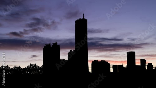 Cityscape of Yeouido, Seoul, South Korea: Time Lapse at Twilight with Colourful Sky and Dark Silhouette of Skyscrapers photo