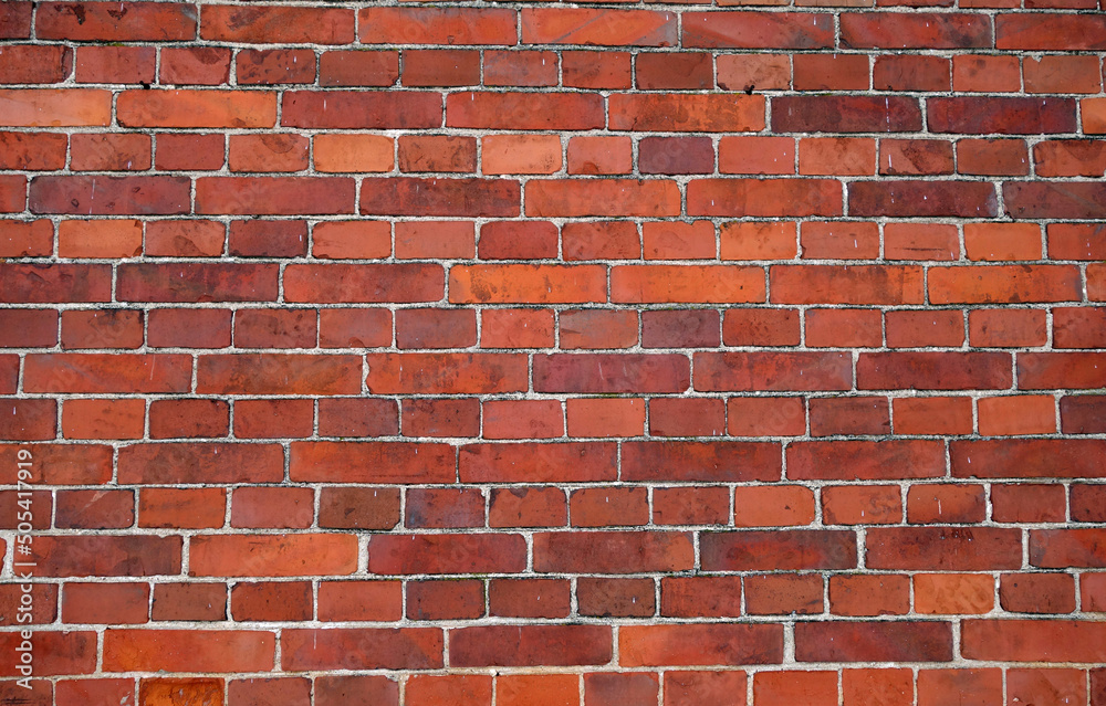 Fototapeta premium Red color brick wall surface.