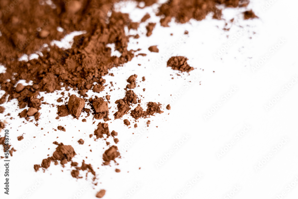 Close up view of dry cocoa on white background with copy space.