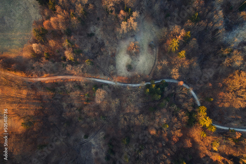 Flying over an autumn forest and river