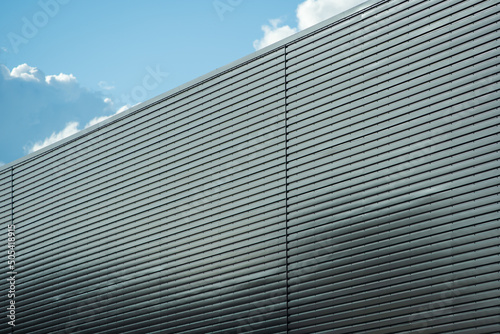 Warehouse wall metal texture surface in industrial estate in england, uk