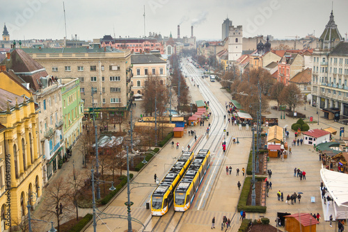 Hungary - Debrecen - Aerial view of central Kossuth square and Piac street and two yellow tramways photo